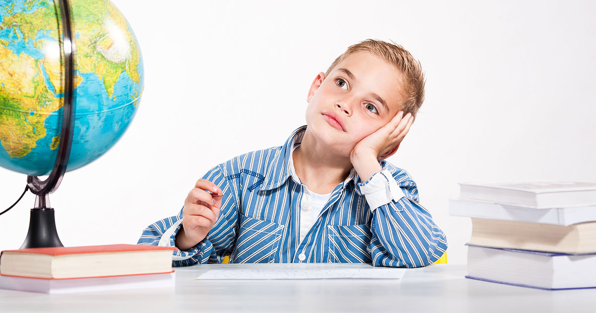 kid with pen and paper