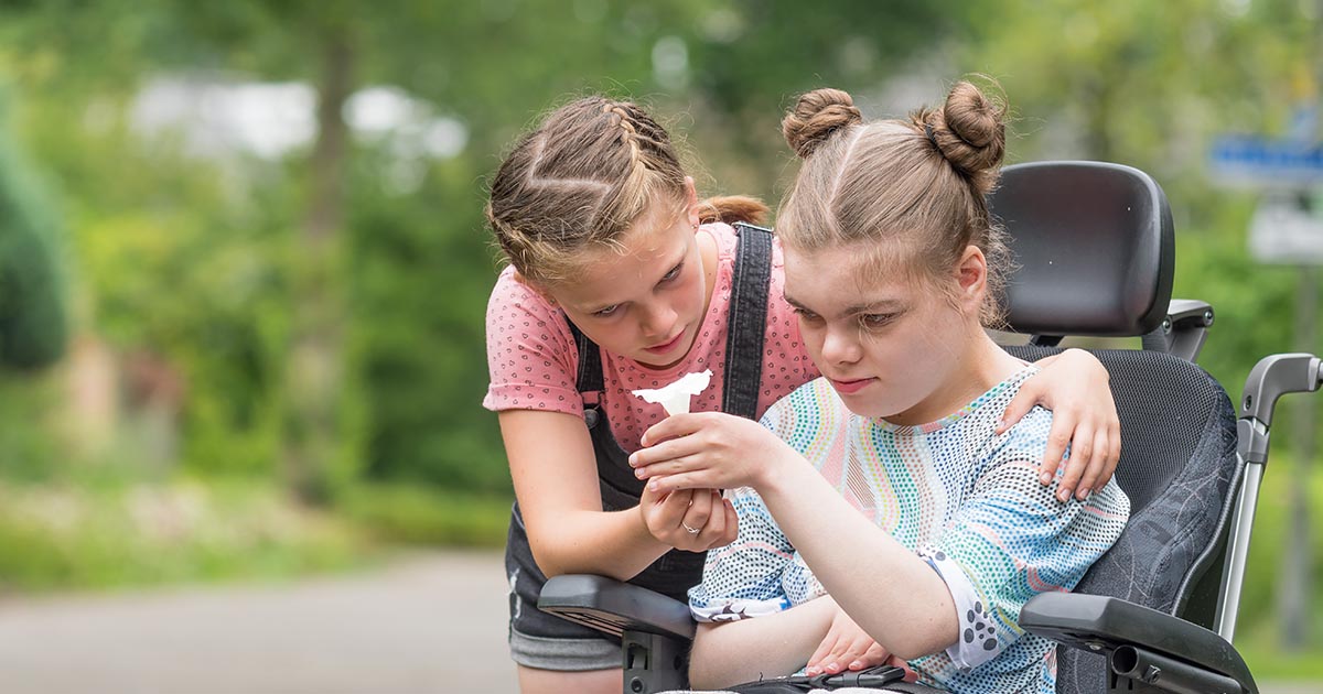 two girls one sitting in wheelchair two girls one sitting in wheelchair from rare epilepsy