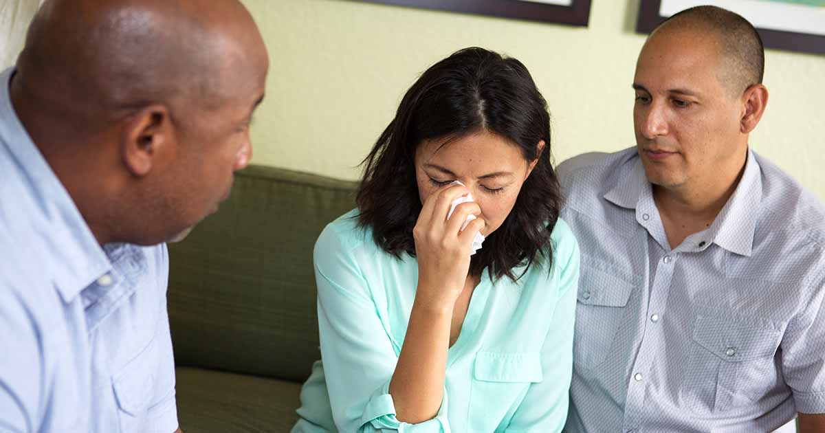 couple-crying-counseling-sad-AdobeStock
