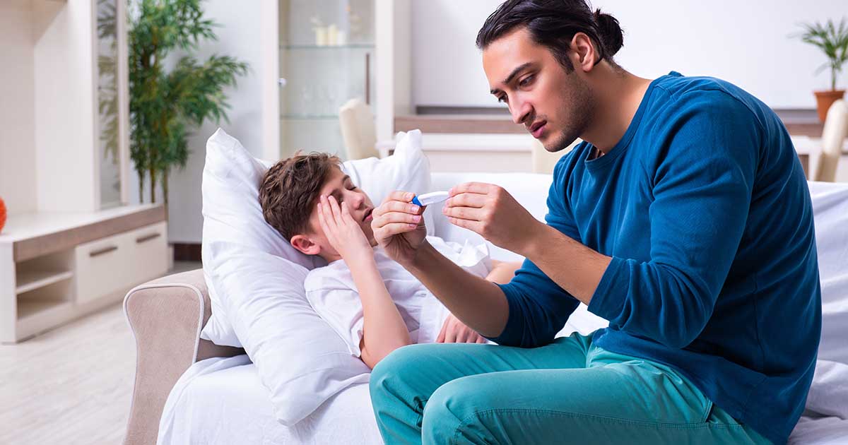 sick son with father