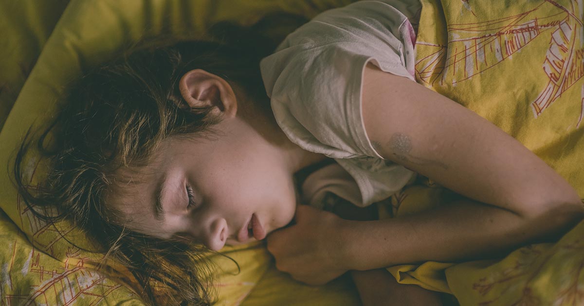 girl-sleeping-recovering-bed-AdobeStock
